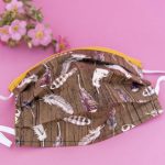 Brown face mask with feather print.