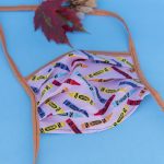 Face mask with crayons.