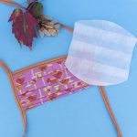 Facemask with straps. Aperol themed fabric.