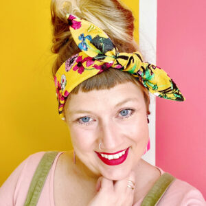 rockabilly Headband with flowers on mustard yellow background.