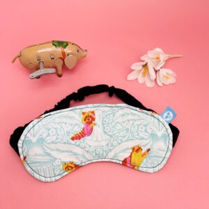 Sleep Mask with green and white pattern with pink racoons