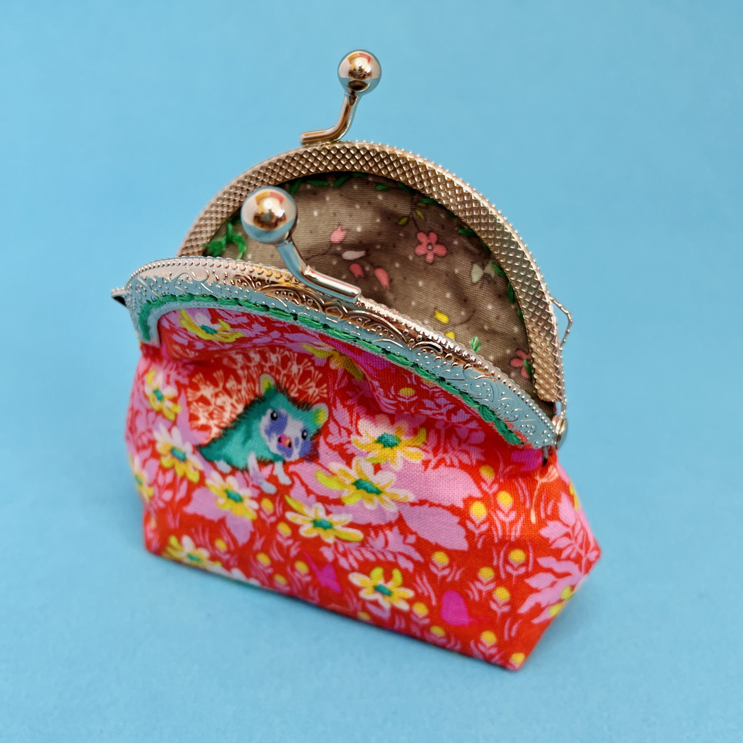 Coin purse with flower hedgehog. Orange, yellow, green.