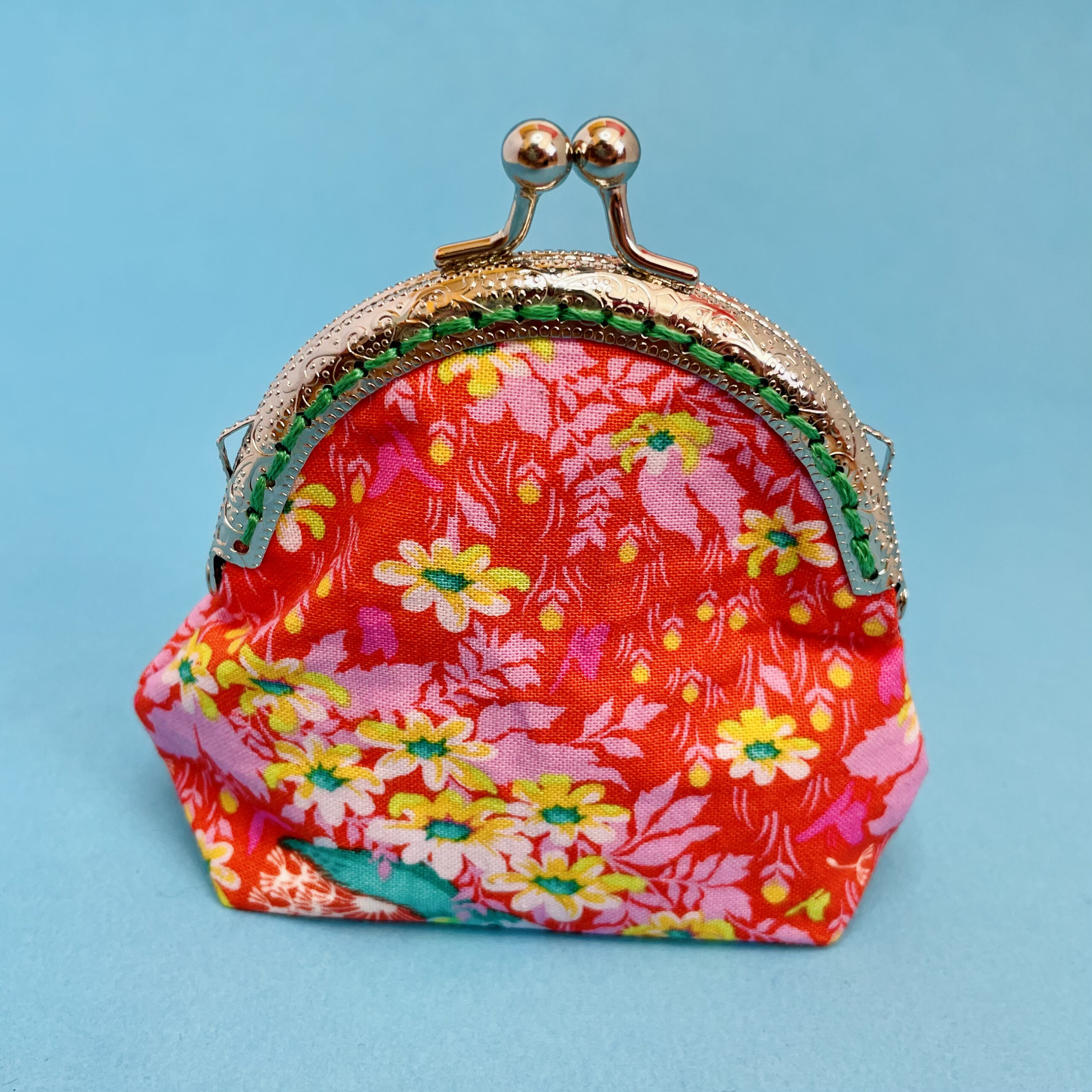 Coin purse with flower hedgehog. Orange, yellow, green.